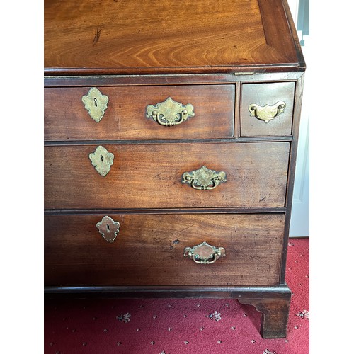 82 - An 18thC mahogany bureau bookcase with candle slides and original brass furnishings. 204cm h x 102cm... 