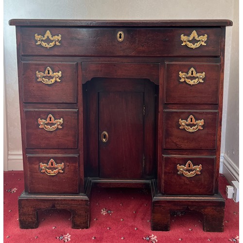 83 - An 18thC mahogany kneehole desk. 77cm h x 76cm w x 45cm d.