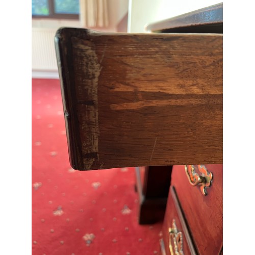 83 - An 18thC mahogany kneehole desk. 77cm h x 76cm w x 45cm d.