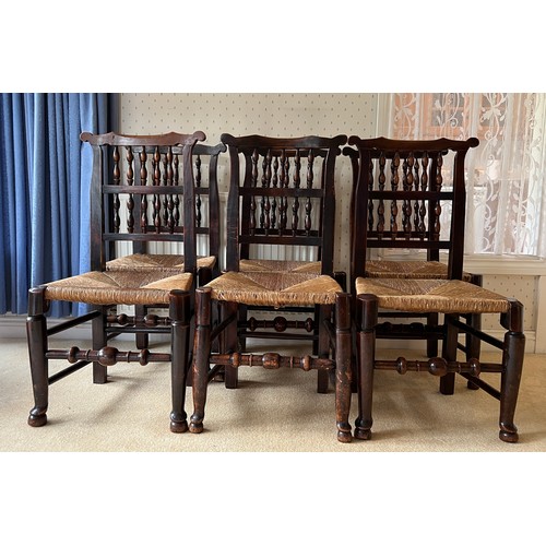 85 - Set of six 18thC fruitwood dining chairs with spell backs and rush seats. 94cm high to back.