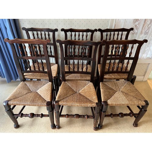 85 - Set of six 18thC fruitwood dining chairs with spell backs and rush seats. 94cm high to back.