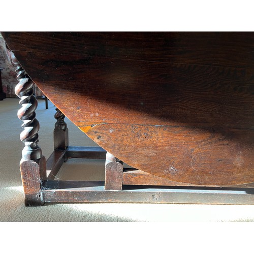 86 - An 18thC oak drop leaf dining table with double twist to the legs and drawer to each side. 74cm h x ... 