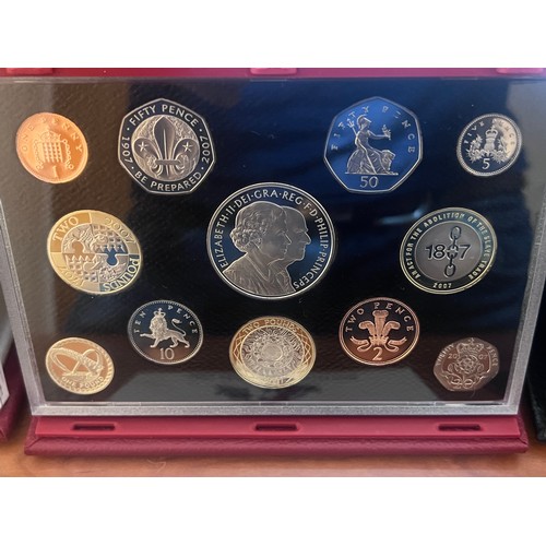 576 - Three cased sets of United Kingdom proof coins, limited editions issued by Royal Mint with accompany... 