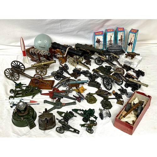 848 - An assortment of miniature canons and military accessories  to include Britains, Dinky, Depose and L... 