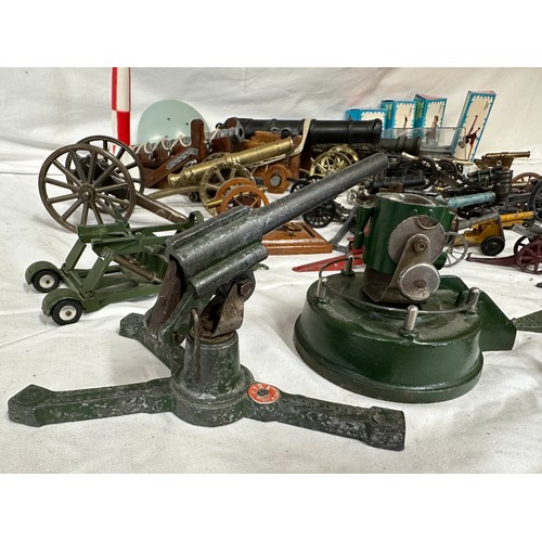 848 - An assortment of miniature canons and military accessories  to include Britains, Dinky, Depose and L... 