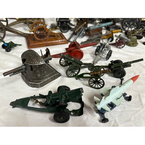 848 - An assortment of miniature canons and military accessories  to include Britains, Dinky, Depose and L... 