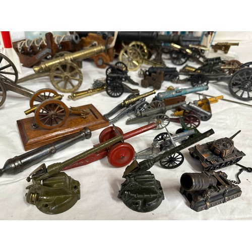 848 - An assortment of miniature canons and military accessories  to include Britains, Dinky, Depose and L... 