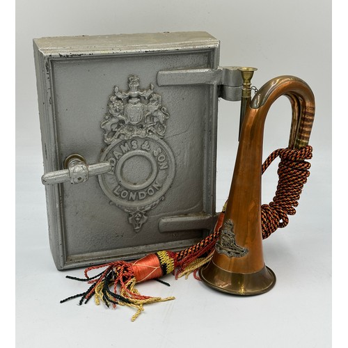 916 - A British Army Royal Artillery brass and copper bugle with yellow, black and red cord tassel and Roy... 