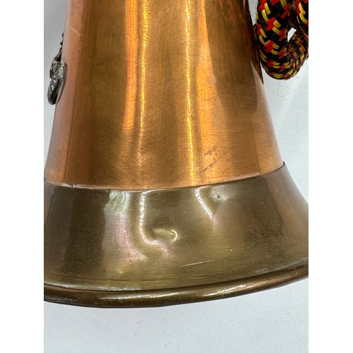 916 - A British Army Royal Artillery brass and copper bugle with yellow, black and red cord tassel and Roy... 