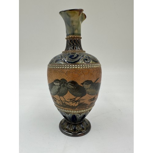 211 - A Doulton Lambeth stoneware baluster shaped vase by Florence. E. Barlow depicting birds, impressed a... 