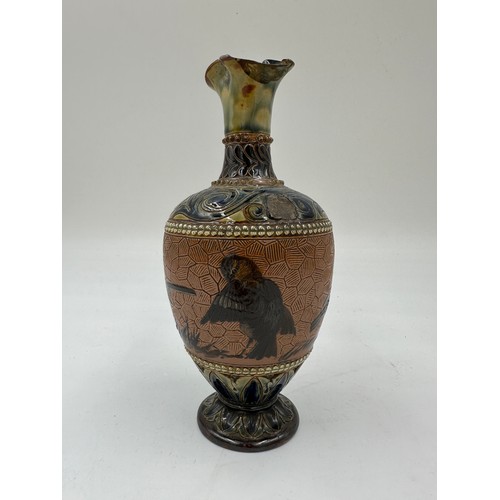 211 - A Doulton Lambeth stoneware baluster shaped vase by Florence. E. Barlow depicting birds, impressed a... 