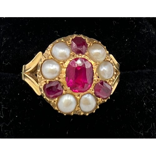 461 - An 18 carat gold ring set with rubies and split pearls. Size M/N. Weight