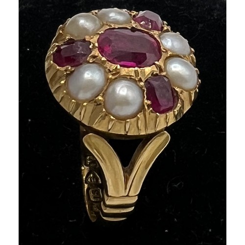 461 - An 18 carat gold ring set with rubies and split pearls. Size M/N. Weight