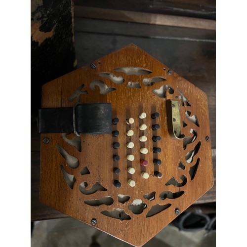 A wooden cased Lachenal concertina, the mahogany ends 16cm w with paper