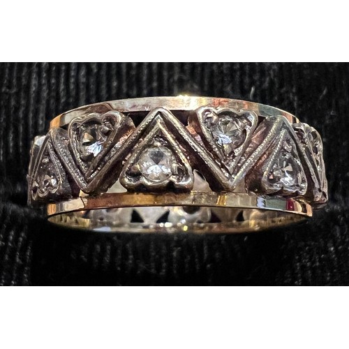 454 - A 9 carat gold eternity ring set with clear stones in heart shaped mounts. Size O, weight 3.5gm.