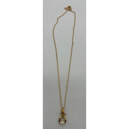 456 - A 9 carat gold cultured pearl and diamond pendant on a 9 carat gold chain. Chain 40cm l.