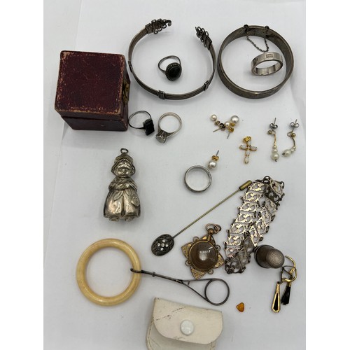 459 - A quantity of silver and other jewellery to include earrings, bangles, thimble, locket etc.