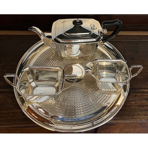 635 - Art Deco style silver plated teapot, milk and sugar bowl together with a plated circular tray, 35.5c... 