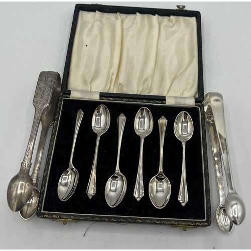 712 - Set of six boxed silver spoons Birmingham 1956, sugar tongs London 1807 William Eley & William Fearn... 