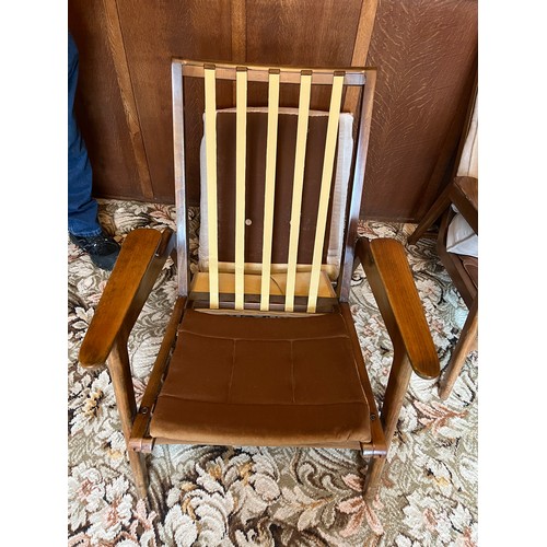 90 - A pair of teak mid 20thC armchairs. Height to back 84cm.