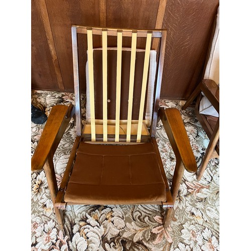 90 - A pair of teak mid 20thC armchairs. Height to back 84cm.