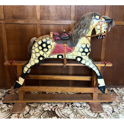 849 - Mid 20thC wooden painted rocking horse. 122cm l x 40cm w.