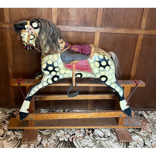 849 - Mid 20thC wooden painted rocking horse. 122cm l x 40cm w.