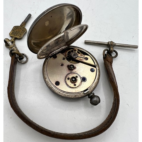 542 - A Continental silver ladies pocket watch with leather strap and key.