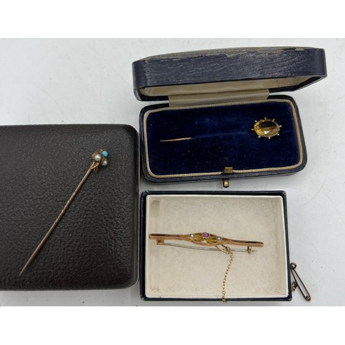 463 - A 15 carat gold tie pin set with seed pearl and turquoise, a yellow metal tie pin set with citrine a... 