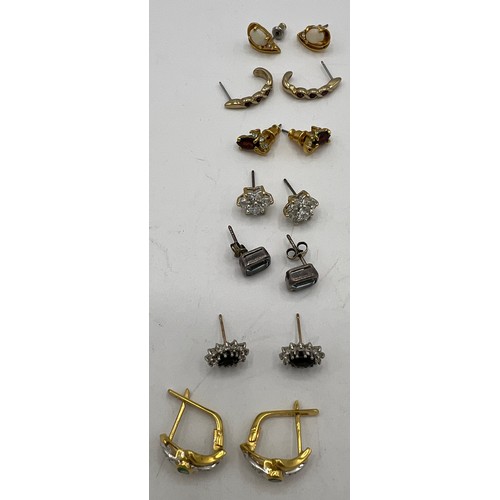 466 - Seven pairs of earrings for pierced ears to include one pair marked.750 set with clear and green sto... 