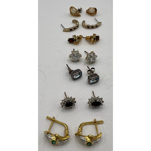 466 - Seven pairs of earrings for pierced ears to include one pair marked.750 set with clear and green sto... 