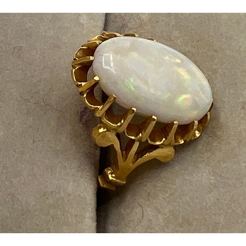 470 - An oval opal in claw setting in yellow metal, tests as 22 carat  gold. Size J, weight 5.5gm.
Opal 15... 