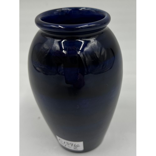 214 - A Moorcroft “Finch” pattern vase on blue ground. 10.5cm h.