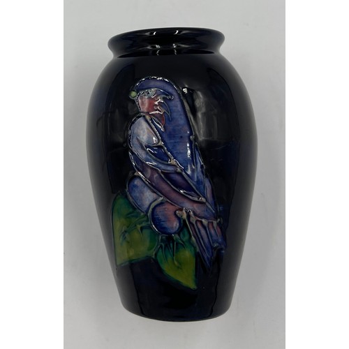 214 - A Moorcroft “Finch” pattern vase on blue ground. 10.5cm h.