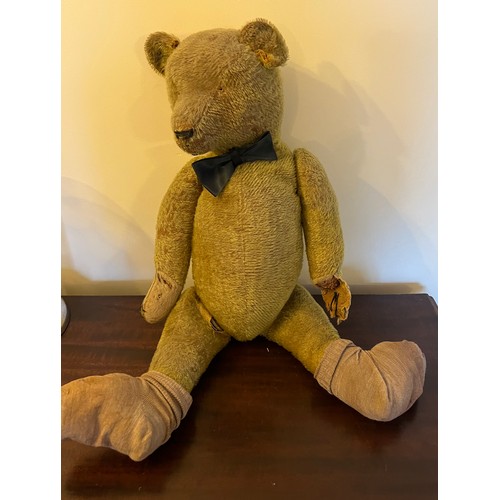 850 - An early 20thC teddy bear 64cm h.