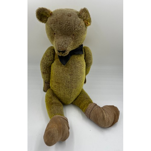 850 - An early 20thC teddy bear 64cm h.