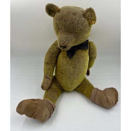 850 - An early 20thC teddy bear 64cm h.