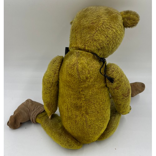 850 - An early 20thC teddy bear 64cm h.