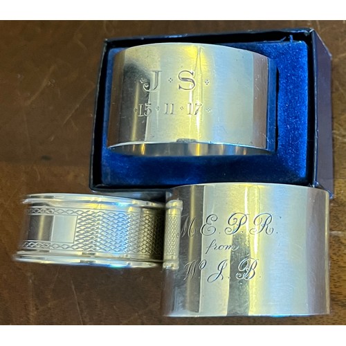 725 - Three hallmarked silver napkin rings, total weight 85gm. Various dates and makers.