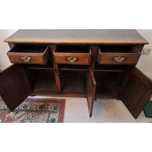 106 - A good quality oak dresser base, three drawers over three cupboards. 84cm h x 139cm w x 45cm d.