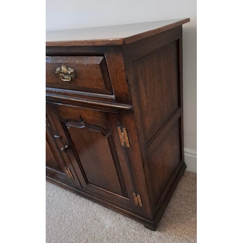 106 - A good quality oak dresser base, three drawers over three cupboards. 84cm h x 139cm w x 45cm d.