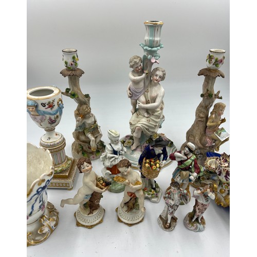 216 - A quantity of mainly 19thC continental ceramics to include Jacob Petit inkstand, figurines, candlest... 