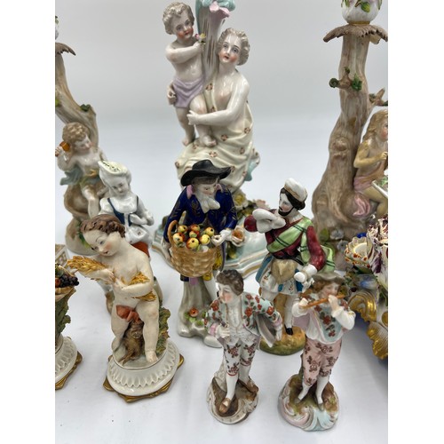 216 - A quantity of mainly 19thC continental ceramics to include Jacob Petit inkstand, figurines, candlest... 