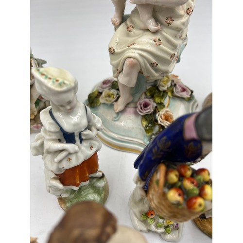 216 - A quantity of mainly 19thC continental ceramics to include Jacob Petit inkstand, figurines, candlest... 