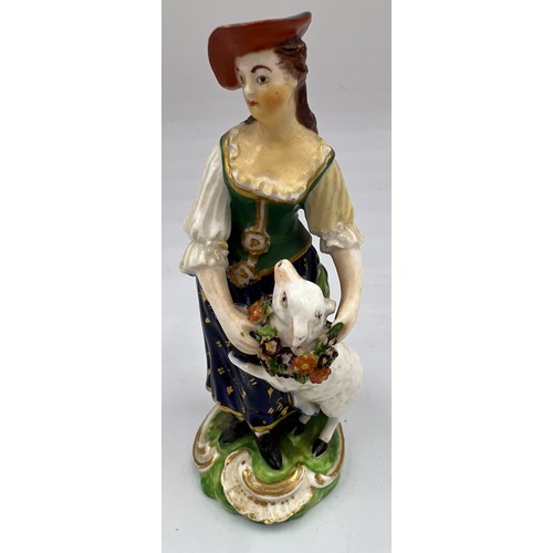 218 - An 18thC figure of a shepherdess, 13.5cm h. Marked N 40 to base.