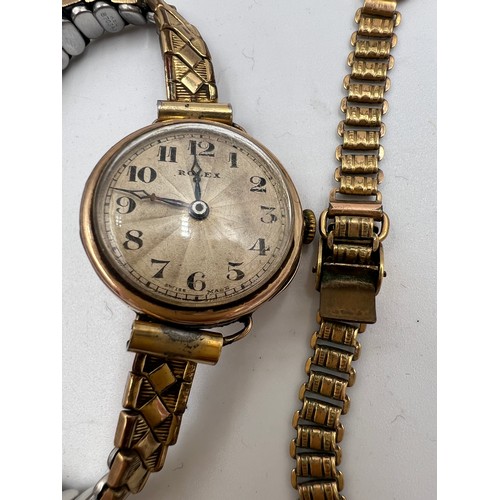 543 - A nine carat gold cased ladies Rolex wristwatch on rolled gold expanding bracelet. 2.5cm d. Total we... 