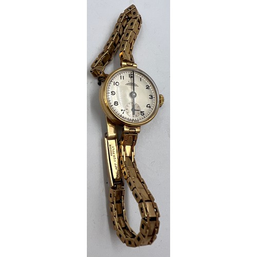 544 - A Garantex 9 carat gold ladies wristwatch on 9 carat gold strap. Total weight 20gm.