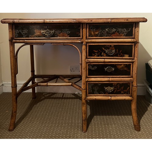 99 - A 19thC bamboo and lacquer kneehole desk with brass drop handles. 90cm w x 51cm d x 76cm h.