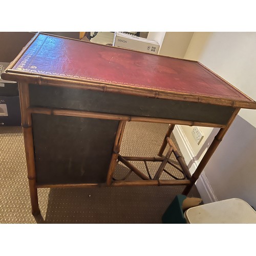 99 - A 19thC bamboo and lacquer kneehole desk with brass drop handles. 90cm w x 51cm d x 76cm h.