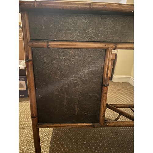 99 - A 19thC bamboo and lacquer kneehole desk with brass drop handles. 90cm w x 51cm d x 76cm h.